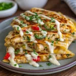 Cheesy Hot Honey Chicken Quesadillas with Spicy Jalapeño Cream Sauce
